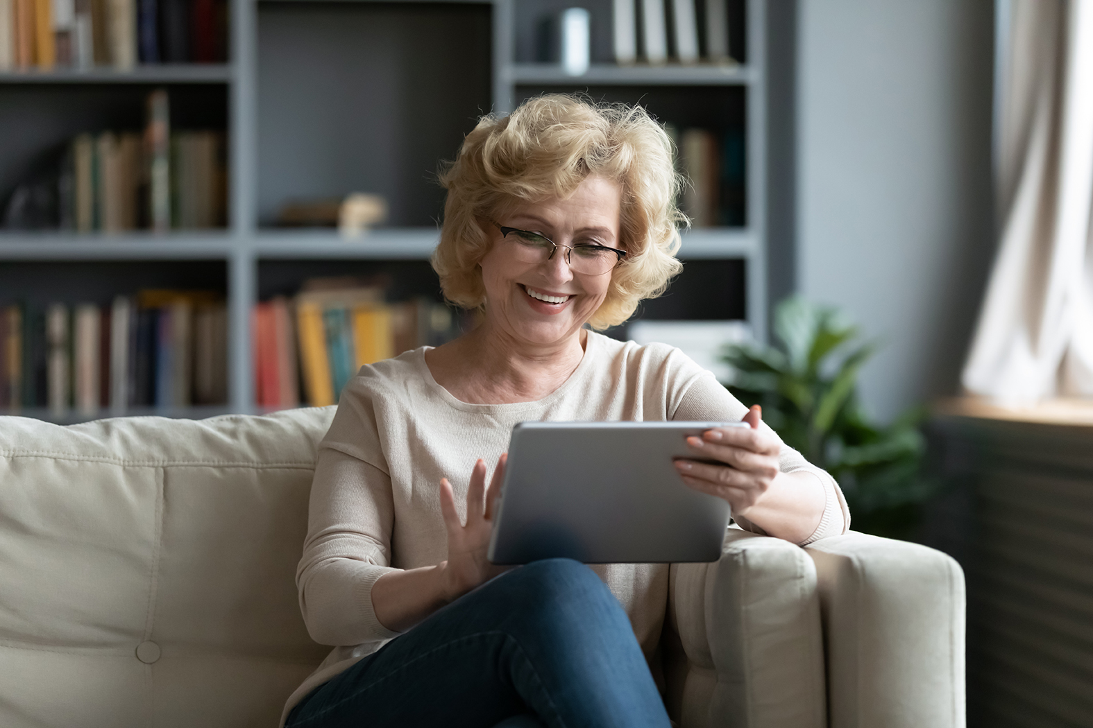 Woman reading on tablet